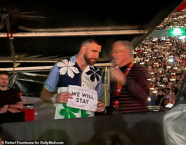 Posing with posters: The blonde bombshell put on a performance for the fans, with Kelce and her father posing with 'We Will Stay' posters during the Archer - a movement with the Argentinian Swifties