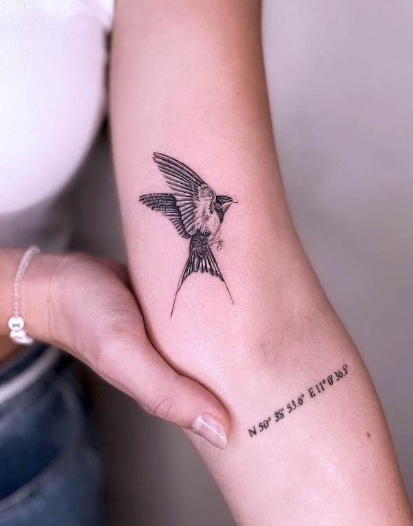 Feminine swallow elbow tattoo by @official.aboutink