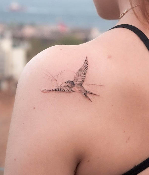 Small swallow shoulder tattoo by @ayhanmetin