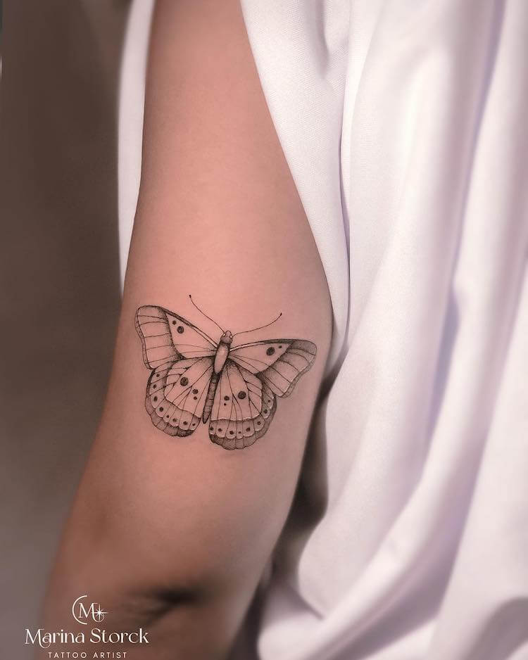 Butterfly Above the Elbow tattoo