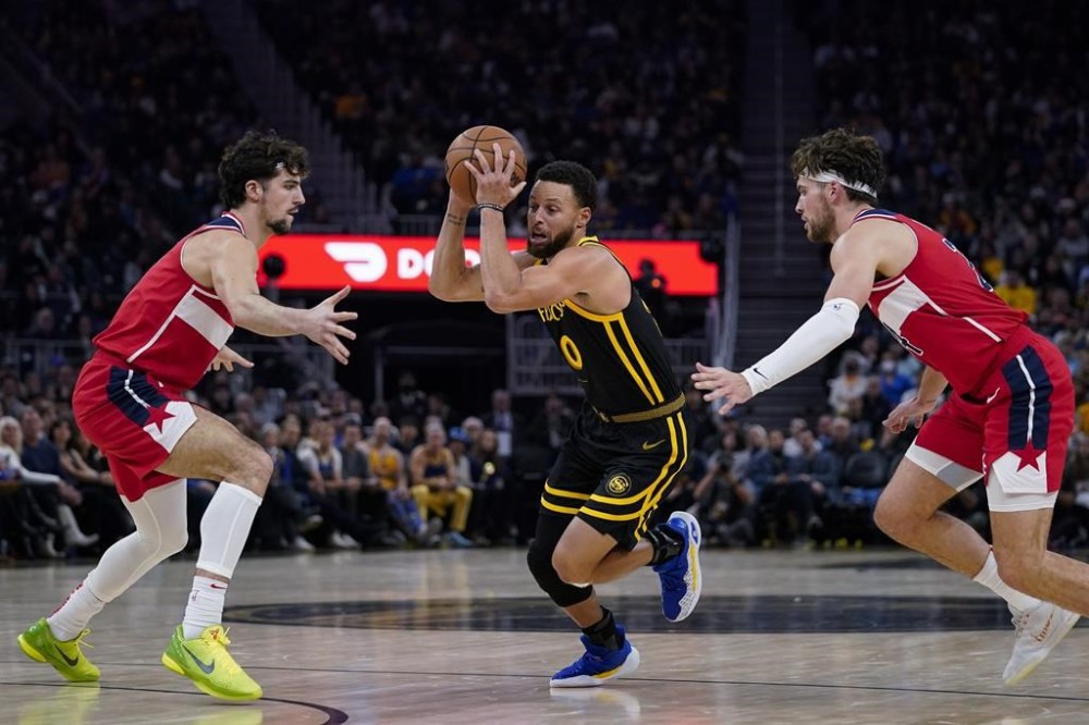 Stephen Curry outduels former teammate Jordan Poole to help Warriors beat  Wizards, 129-118 – Winnipeg Free Press