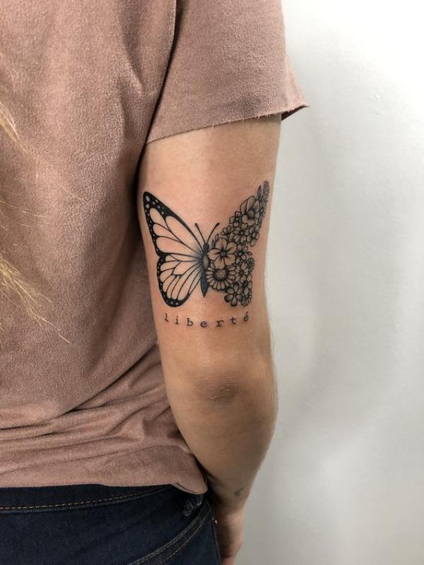 Half butterfly half flowers Metallic dragonfly back of arm tattoo