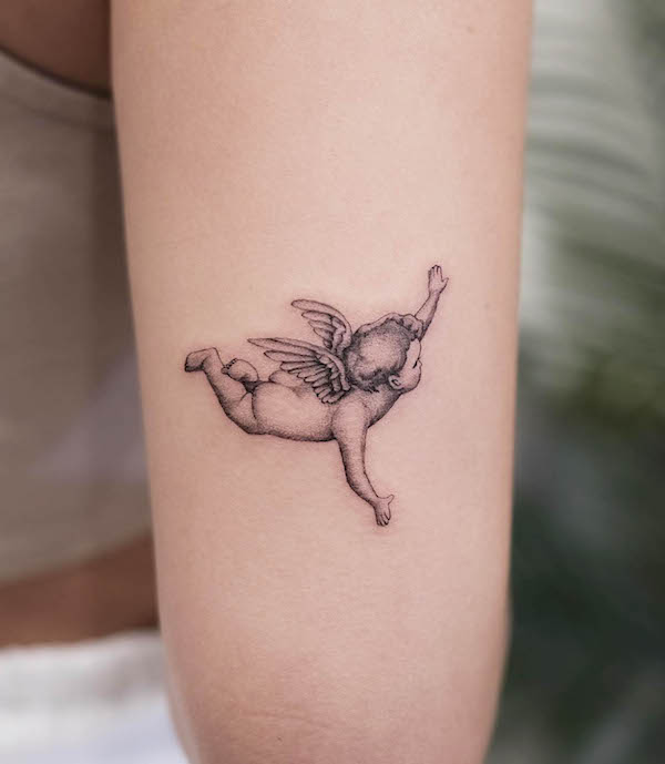 Little flying angel tattoo by @tattooist_erick