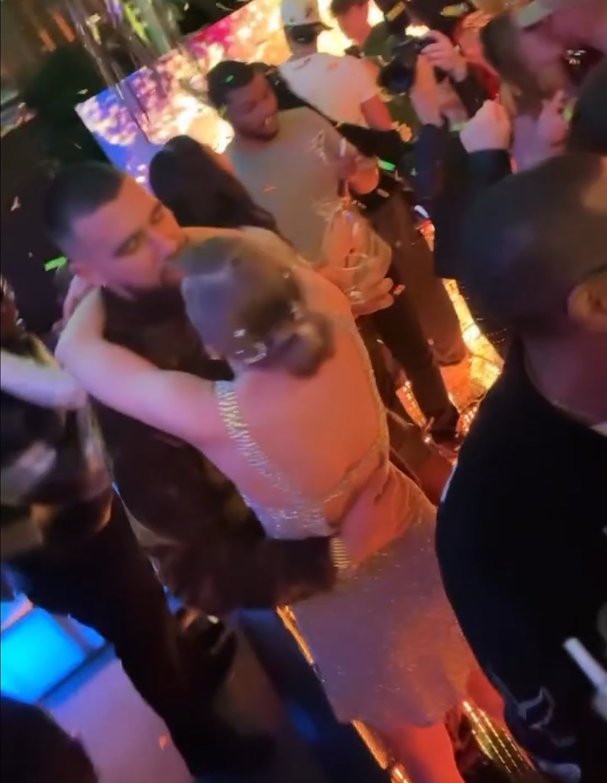 Travis Kelce kissing Taylor Swift.