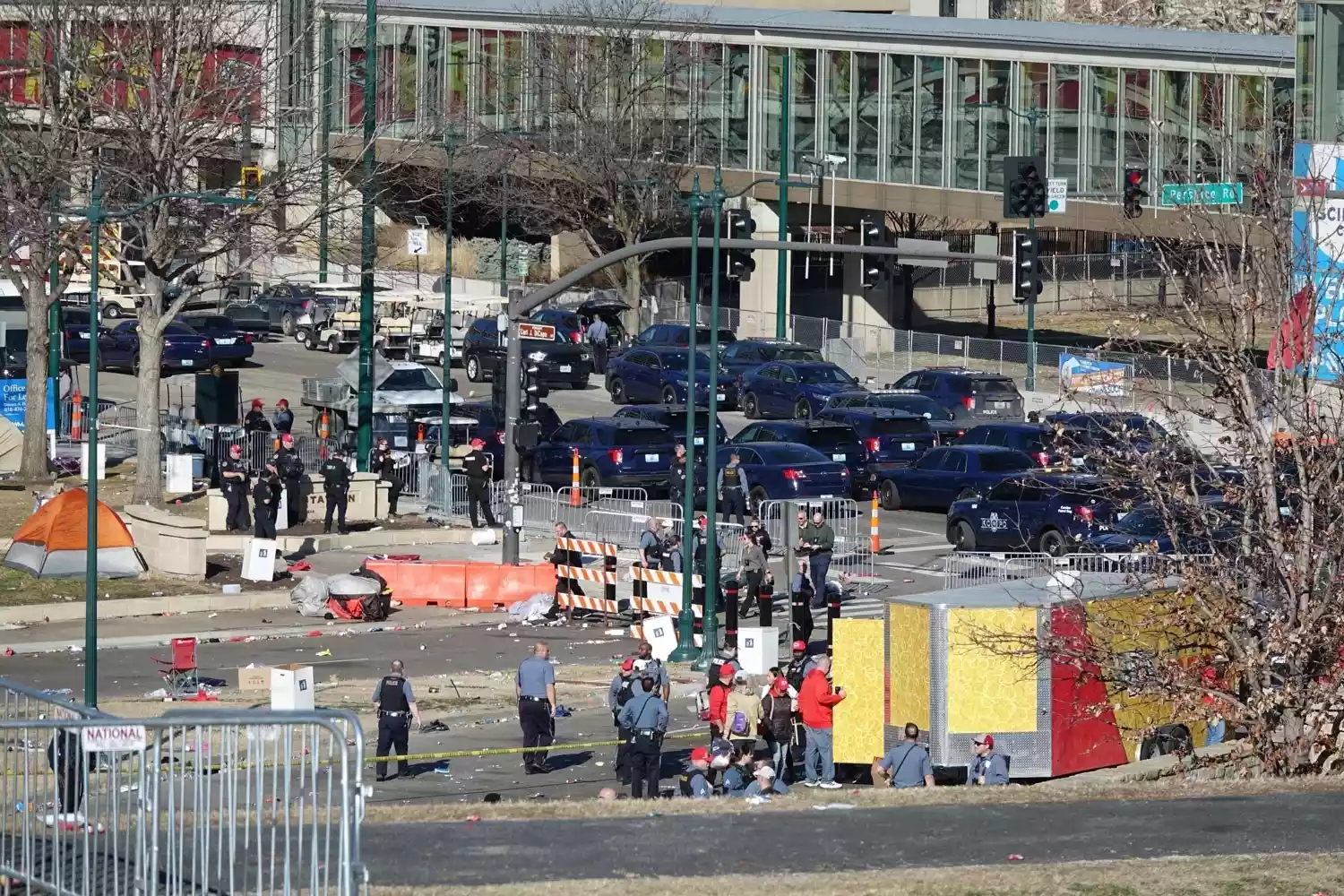 Detectives were seen investigating shootings at Liberty Memorial Park and obtaining footage from witnesses after shooting during the Superbowl Victory Celebration in Kansas City, MO helicopters were seen overhead and police also used drones to survey the scene.