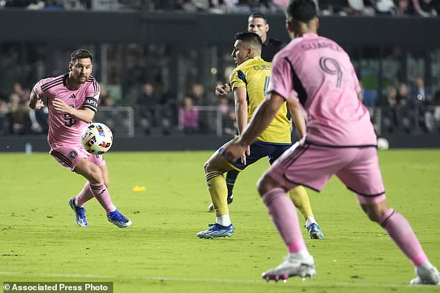 Inter Miami forward Lionel Messi, left, passes the ball to forward Luis Suarez (9) during the first half of the team's MLS soccer match against Real Salt Lake, Wednesday, Feb. 21, 2024, in Fort Lauderdale, Fla. (AP Photo/Lynne Sladky)