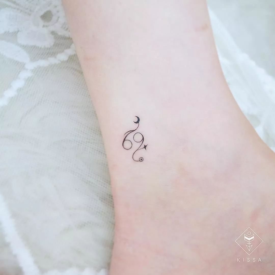 Image of a small Cancer symbol tattoo