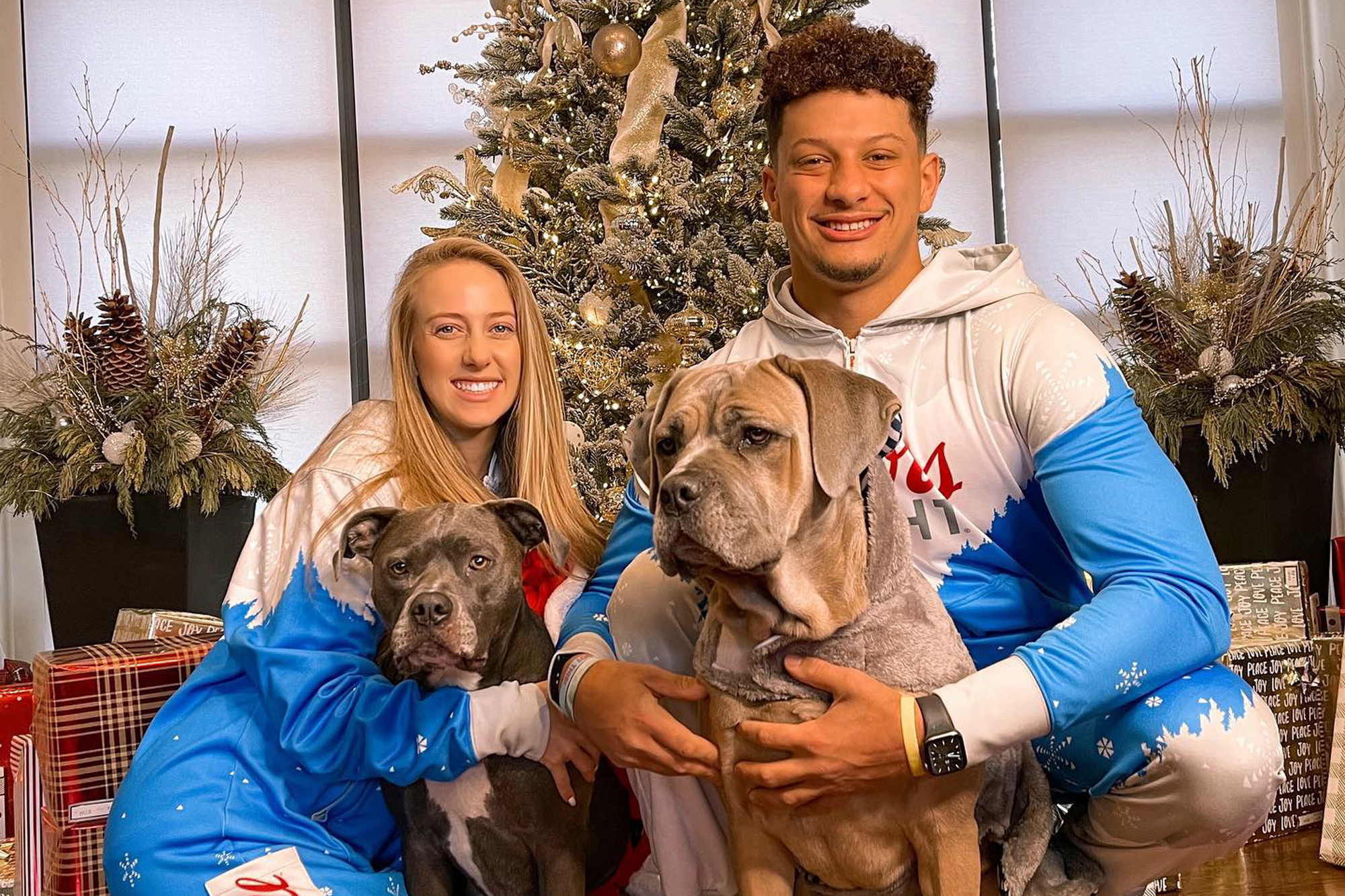 A photo of Patrick and Brittany Mahomes with their dogs during the holiday