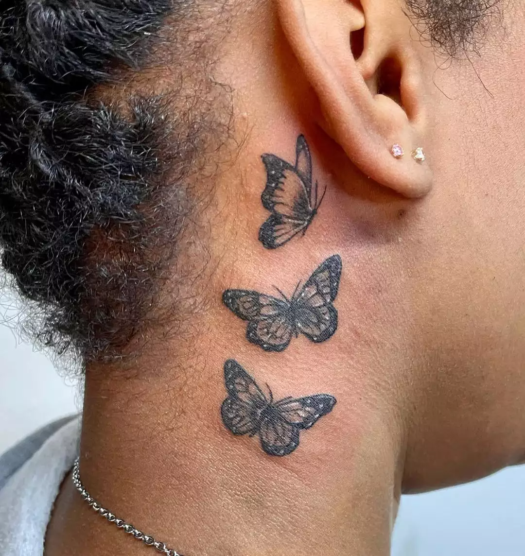 Behind the ear butterflies tattoo