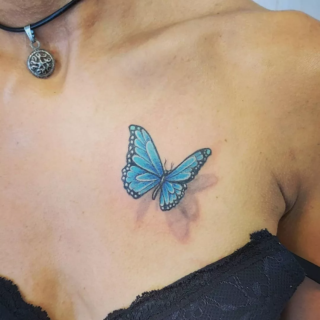 Close up of a blue butterfly tattoo with shading