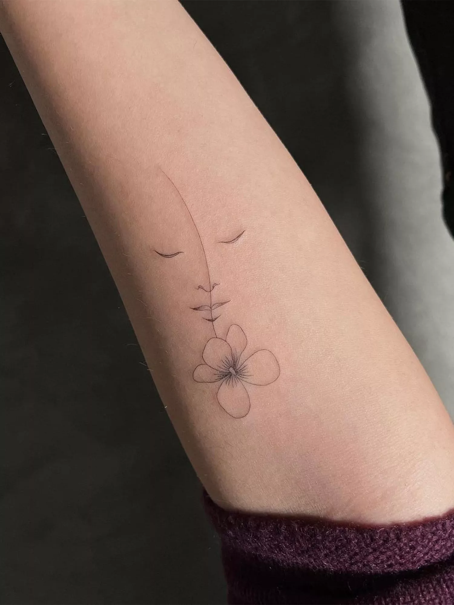flower tattoo on forearm