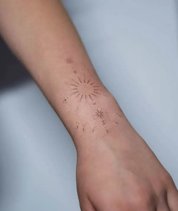 Dainty sun ornamental tattoo by @ink.ing
