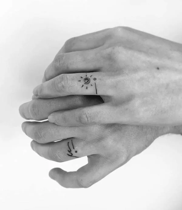 Matching ring finger tattoos by @yuantattoodesign