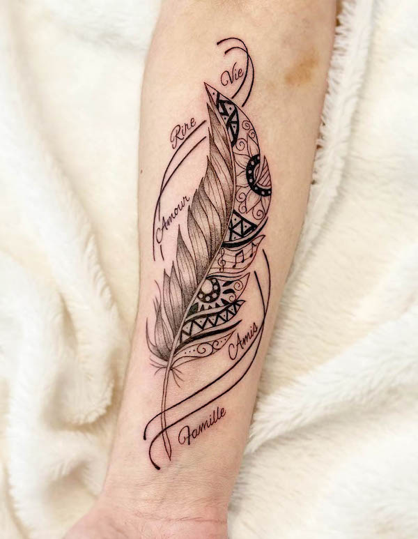 Meaningful feather tattoo with words and patterns by @risedtattoo