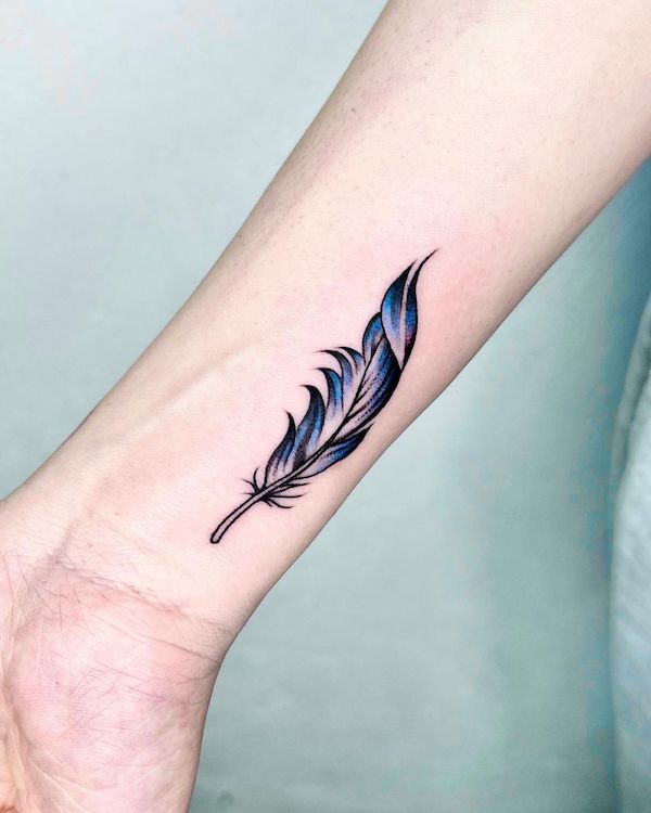 Simple feather wrist tattoo by @222_tattoo