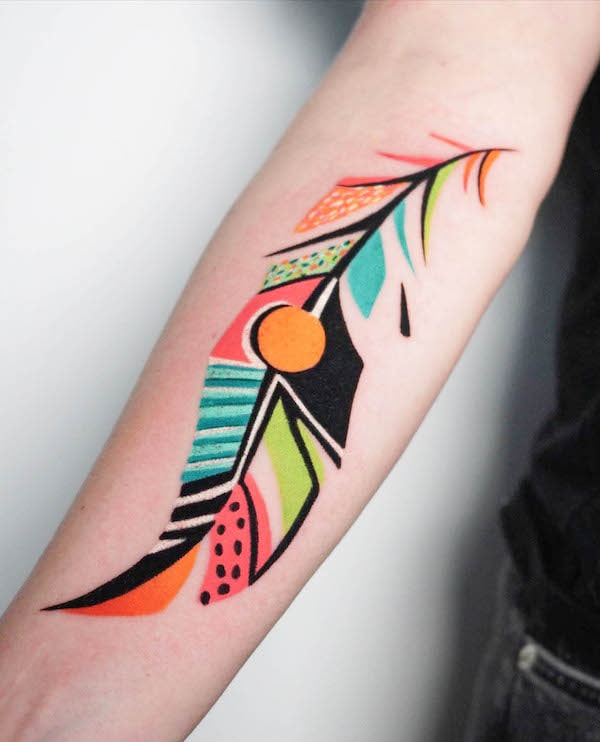 Contemporary colored feather tattoo by @kudutattoo