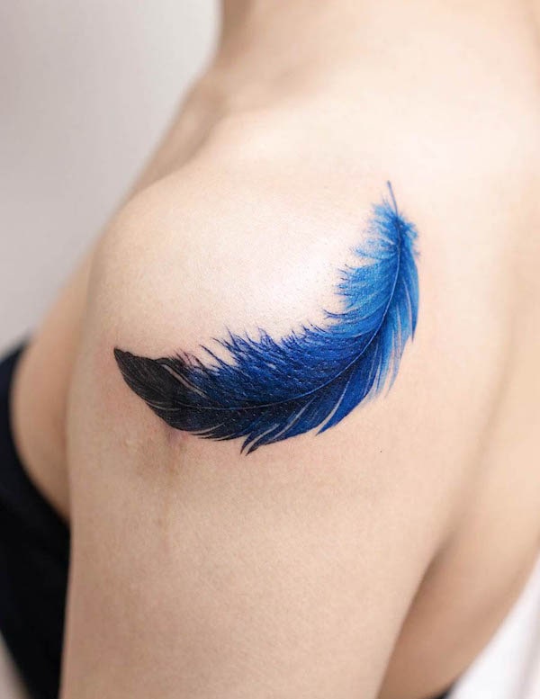 Dark blue feather tattoo by @pokhy_tattoo