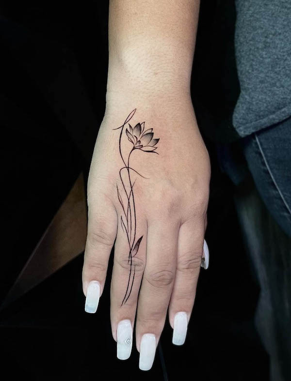 Unique lotus hand tattoo by @poisontattoosupply