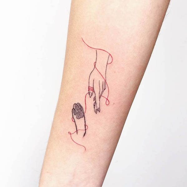 Cute fine line tattoo for dog owners by @studioandersonperosa