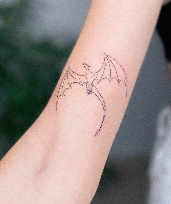 Dainty fine line dragon arm tattoo by @taniabodyart