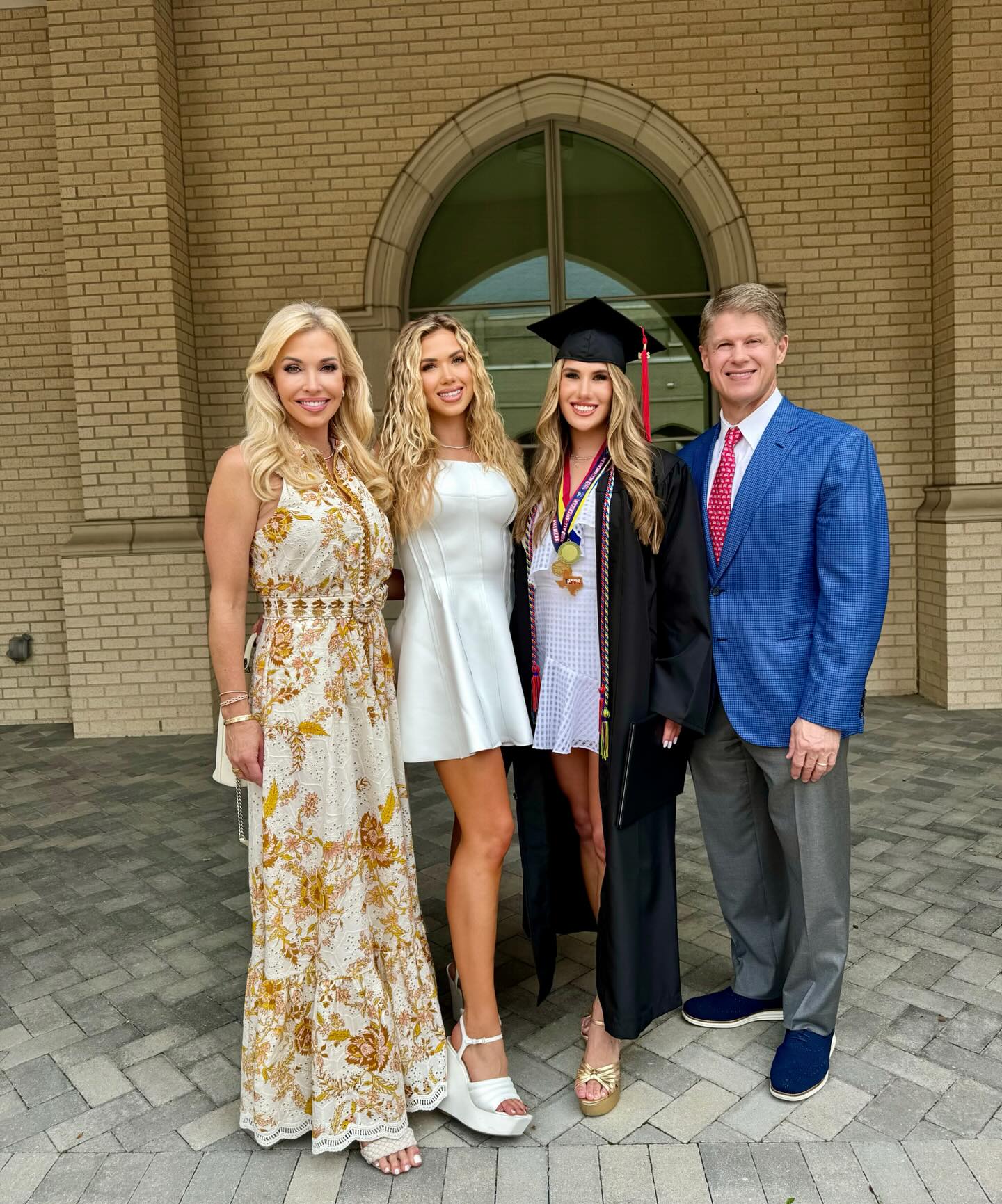 Ava Hunt posing for graduation photos with her family