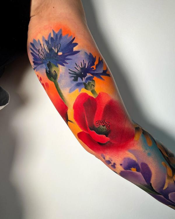 Watercolor cornflower and poppy tattoo
