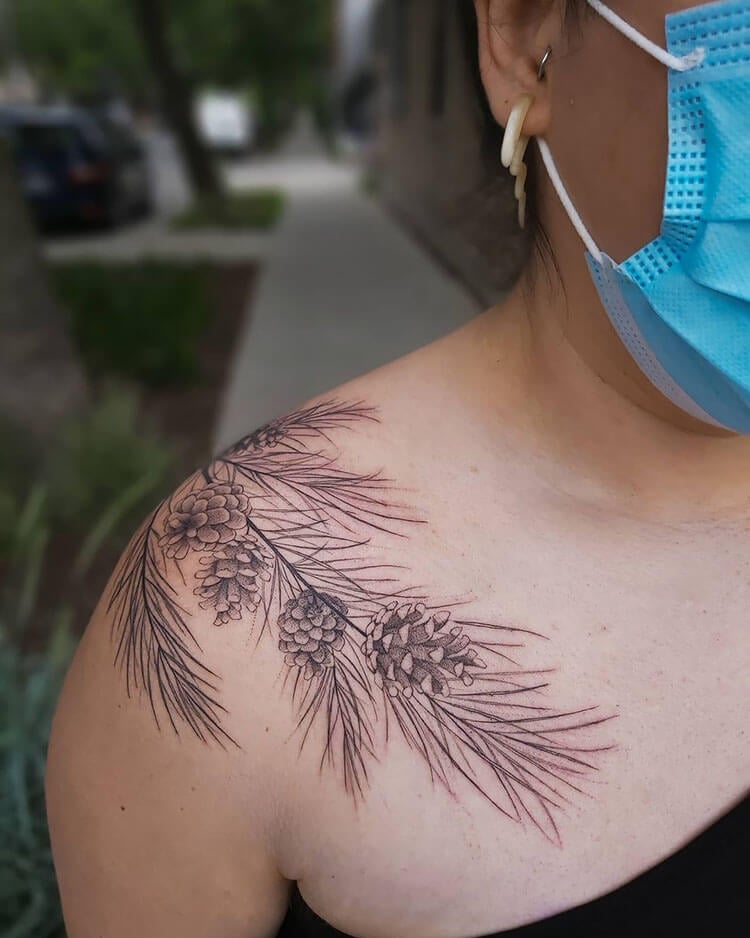 shoulder pinecone and pine needle tattoo