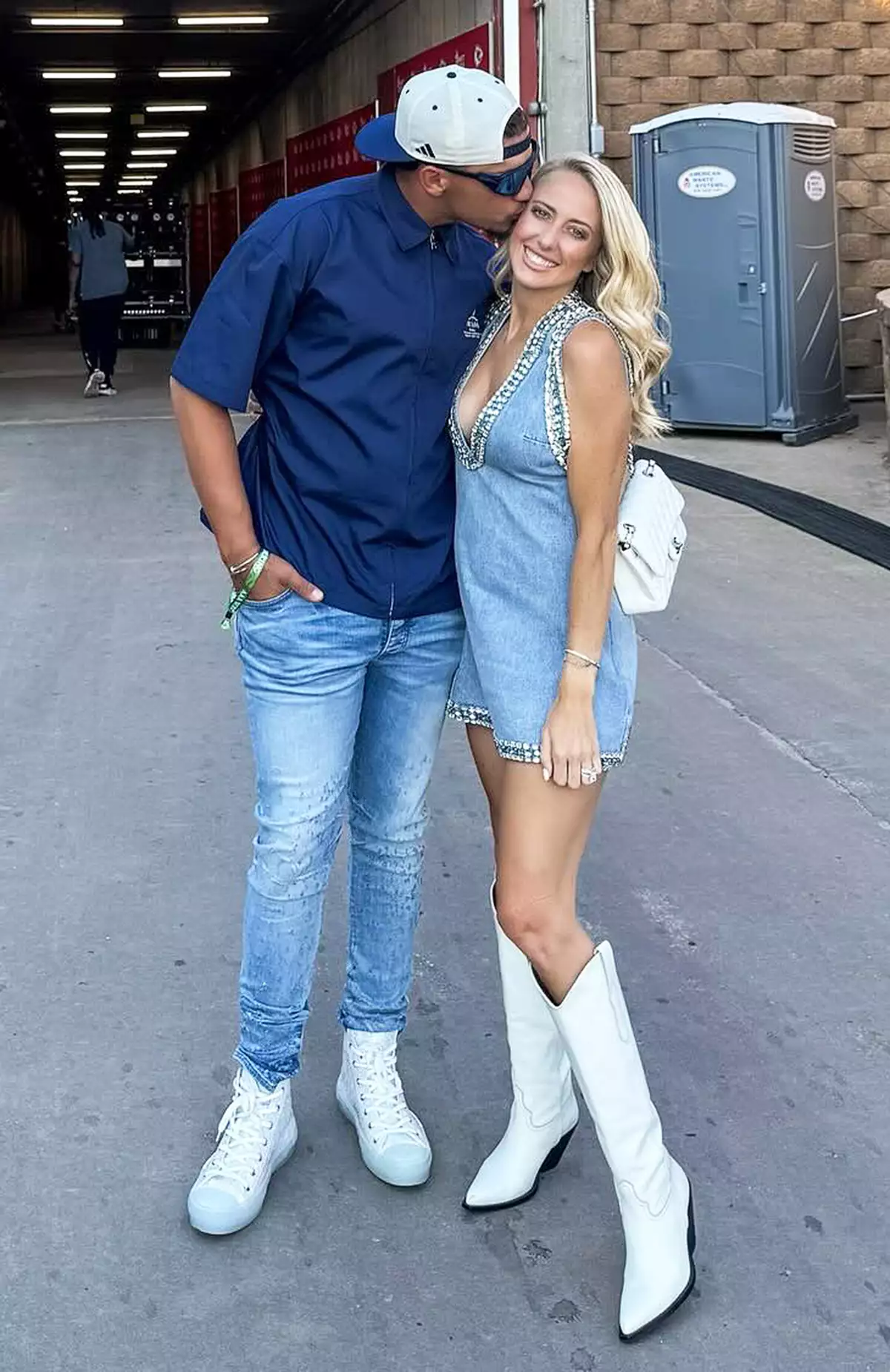 Brittany Mahomes poses with Patrick Mahomes at a Morgan Wallen concert