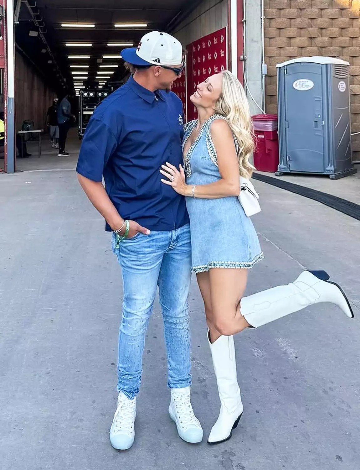 Brittany Mahomes poses with Patrick Mahomes at a Morgan Wallen concert