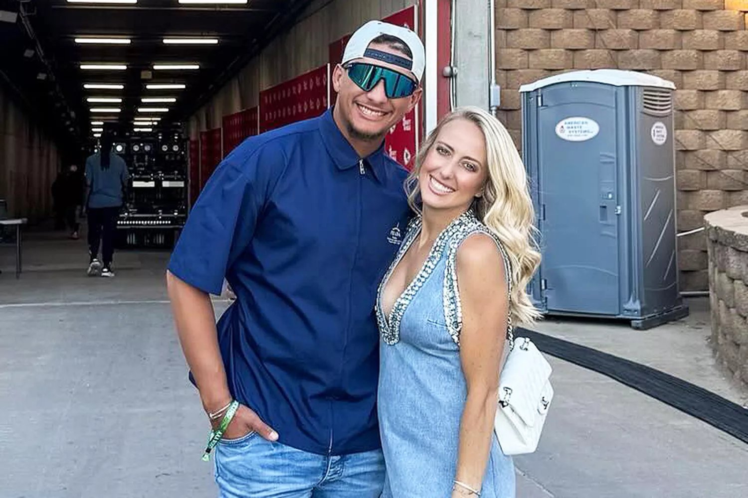 Brittany Mahomes poses with Patrick Mahomes at a Morgan Wallen concert