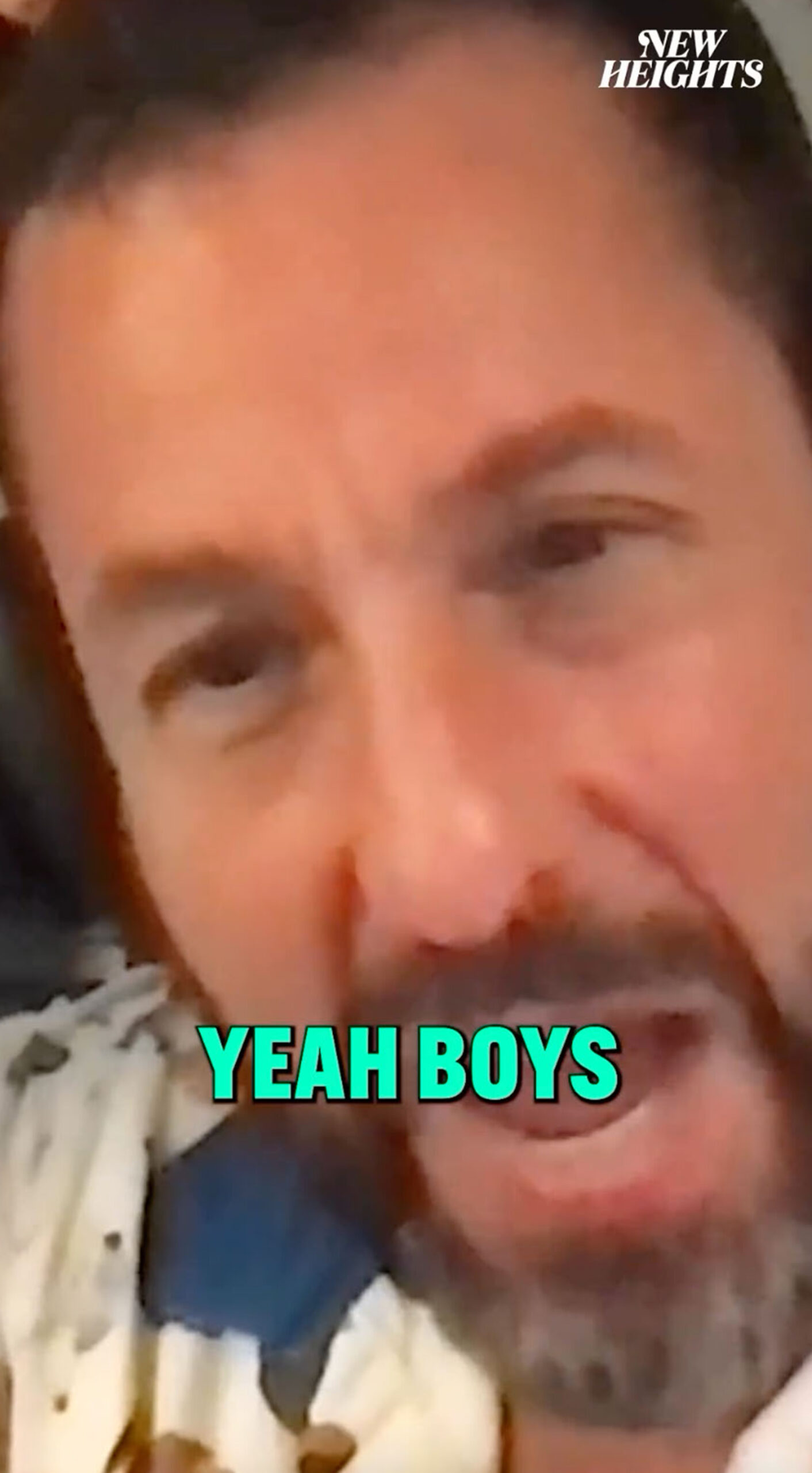 extreme close up of adam sandler's face with "yeah boys" written over it