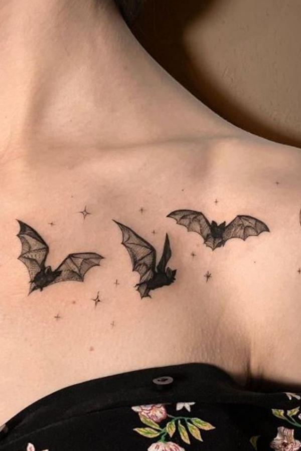 Bats and stars collarbone tattoo