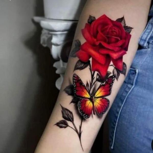 Black and red butterfly and rose tattoo