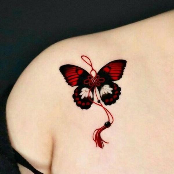 Black and red butterfly with tassel tattoo