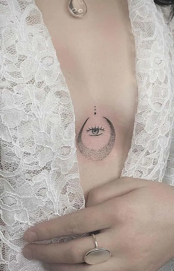 Eye and moon between the boobs tattoo by @hellynk