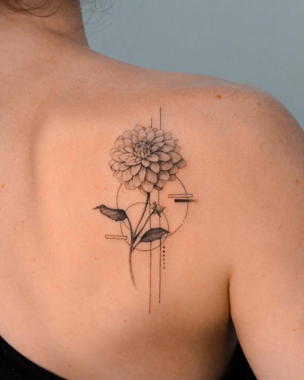 Geometric dahlia tattoo on shoulder blade