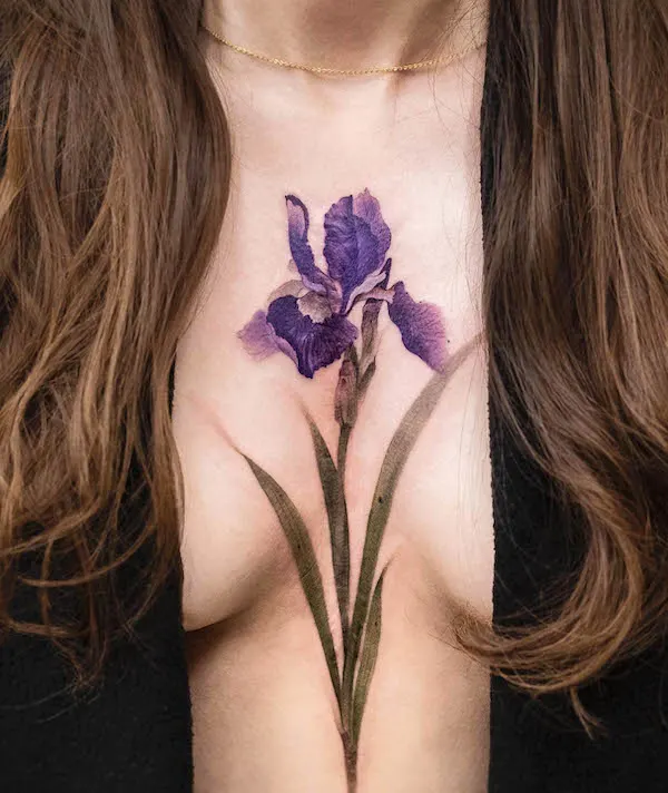 Purple flower cover up tattoo by @chenjie.newtattoo