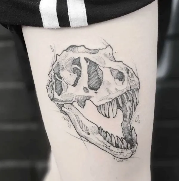 T-rex skull thigh tattoo by @desmaytal.tattoo