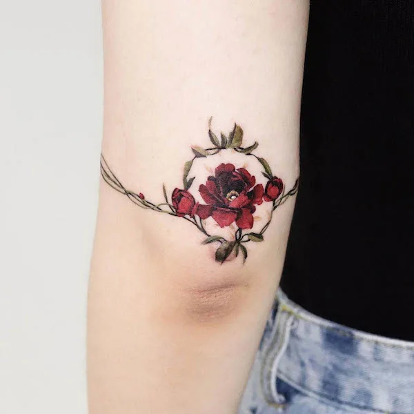 Rose wreath elbow tattoo by @guppy.flowertattoo