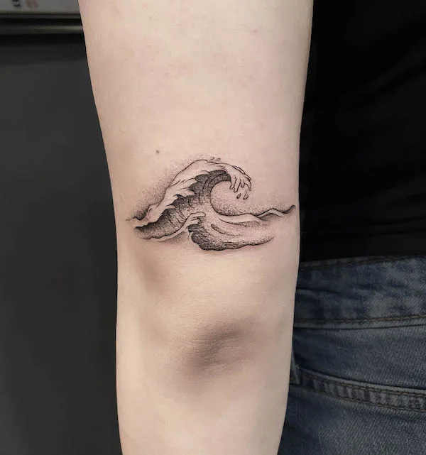 Small wave elbow tattoo by @magpietattooshop