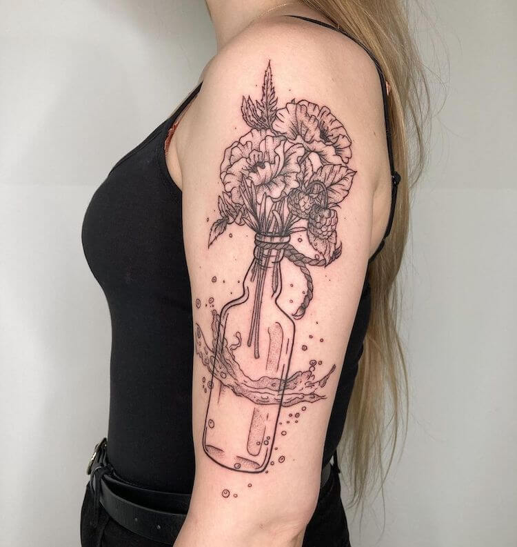 flowers in bottle botanical tattoo