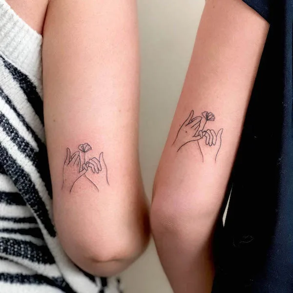 Pinky promise matching elbow tattoos by @abidal_tattoo