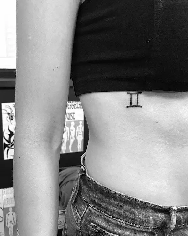 Gemini glyph rib tattoo by @jk.tat_