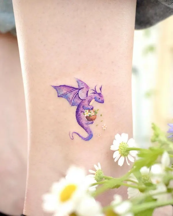 Cute small purple dragon ankle tattoo by @ovenlee.tattoo