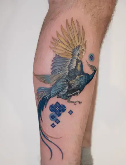 Blue Ink Phoenix Leg Tattoo