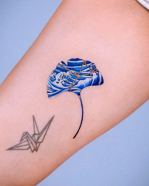 Porcelain ginkgo leaf kintsugi tattoo by @e.nal_.tattoo