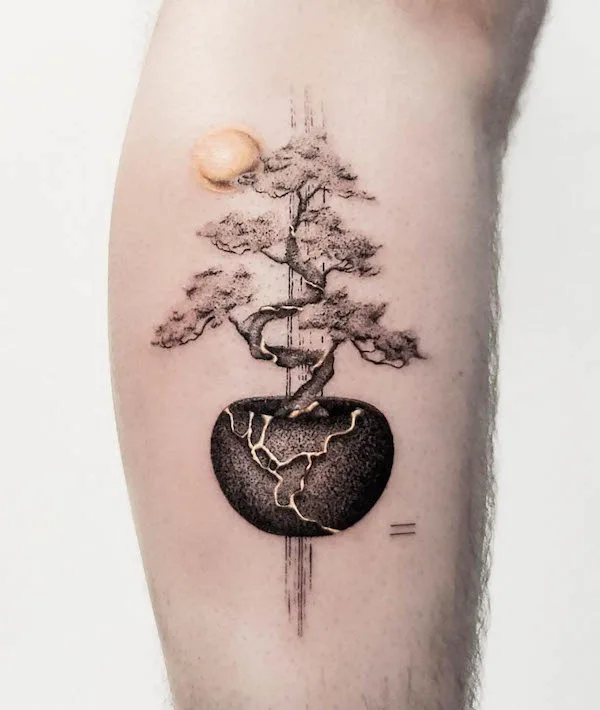 Sun and bonsai kintsugi tattoo by @jamjam.tattoo