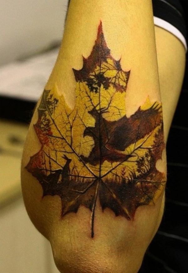 Fall leaf tattoo with silhouettes of rabbit, eagle and landscape