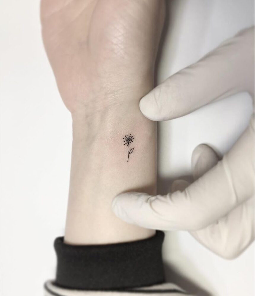 Tiny minimalistic dandelion tattoo on the wrist