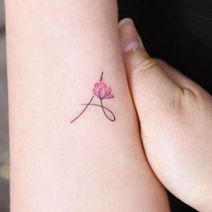 This contains an image of: 46 Unique Initial Tattoos For Men and Women - Our Mindful Life